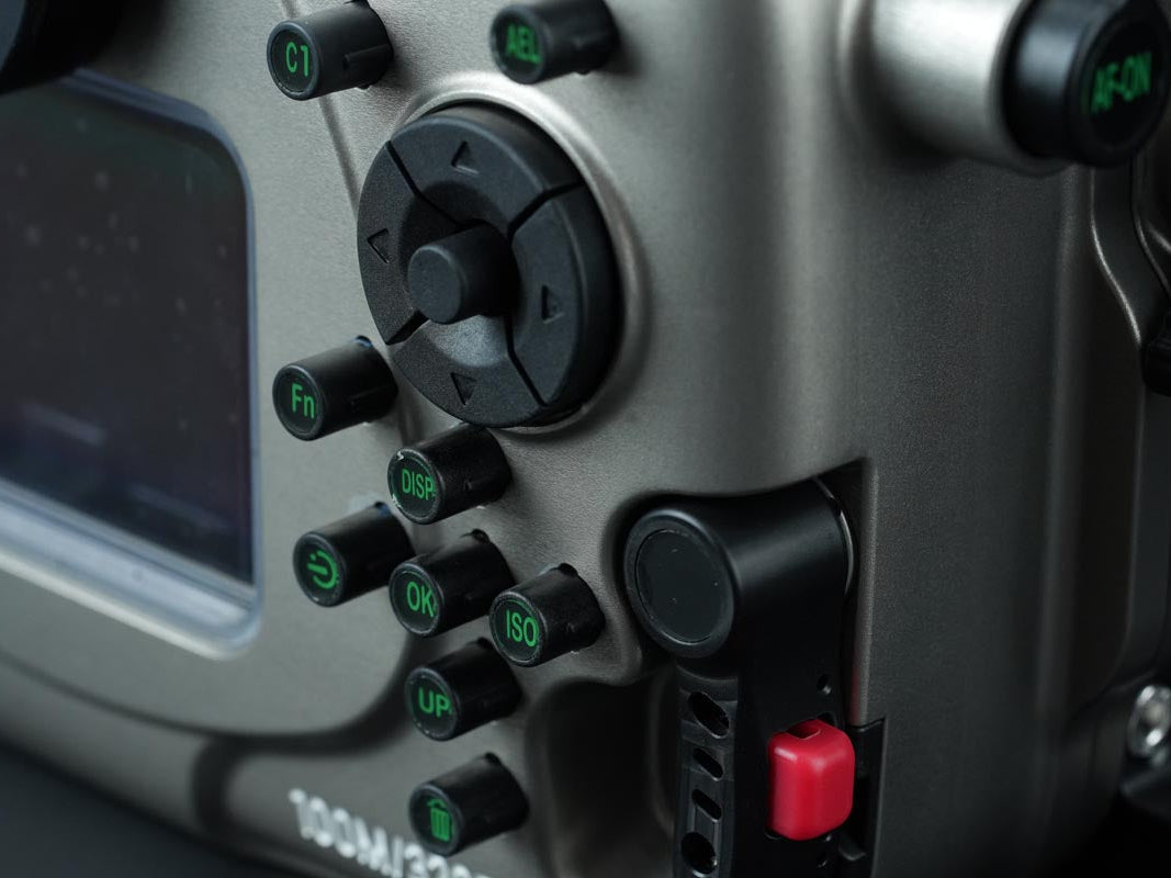 Close-up of a control panel with buttons and knobs on a vehicle or machinery.