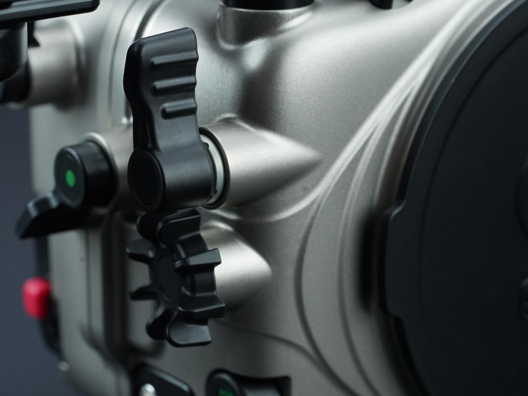 Close-up of a mechanical component with visible branding on a dark background
