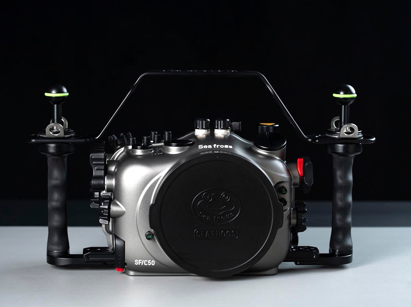 A Seafun SPC50 underwater camera housing with integrated handles and a top handle bar, shown against a dark studio background.