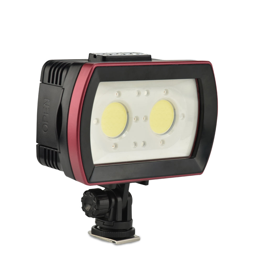Camera light with a white screen and black and red casing on a white background