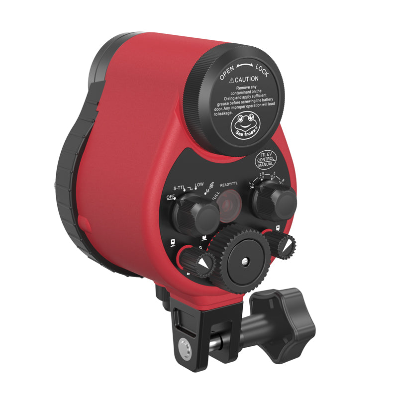 Red and black camera lens with control knobs on a white background