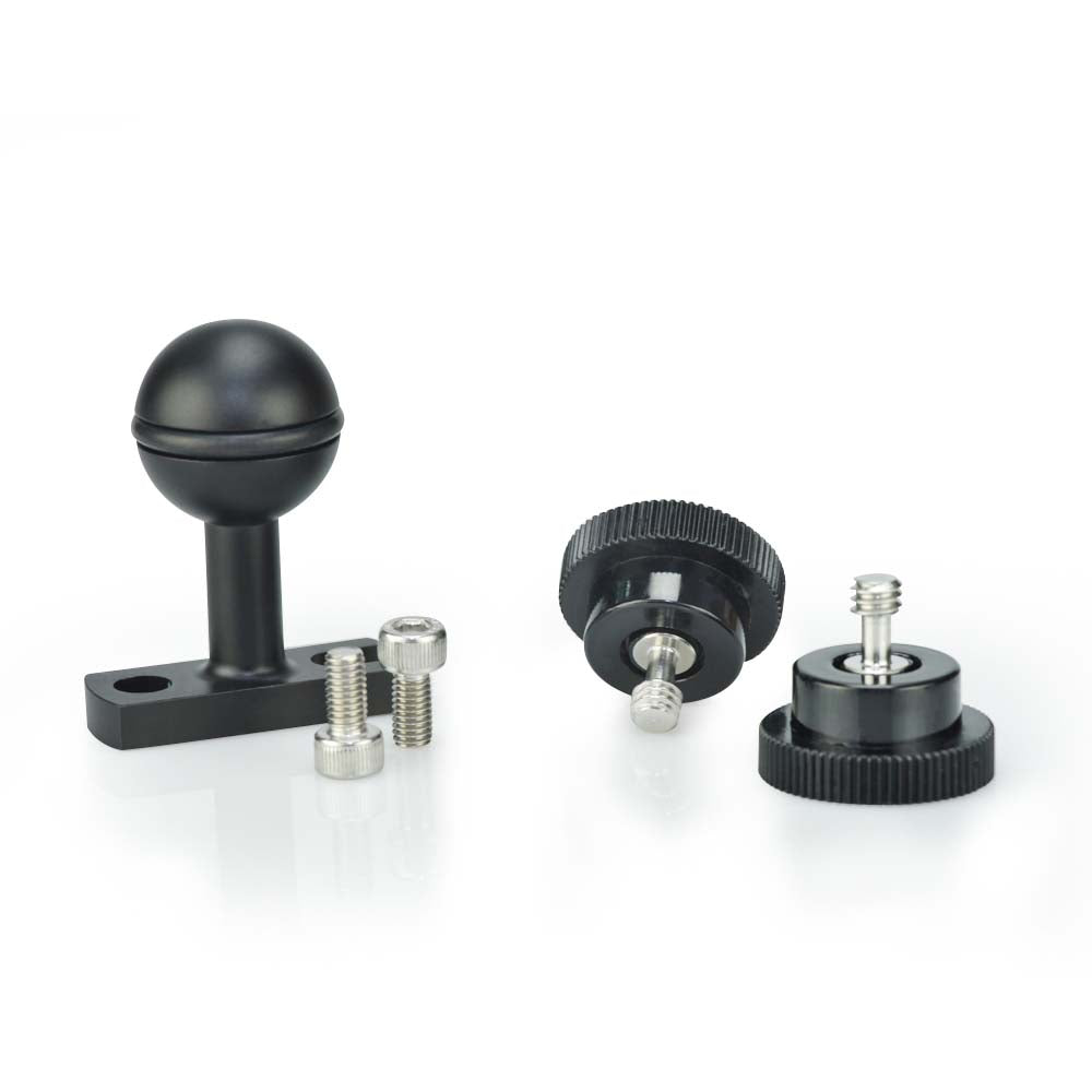 Set of black and metal camera accessories on a white background